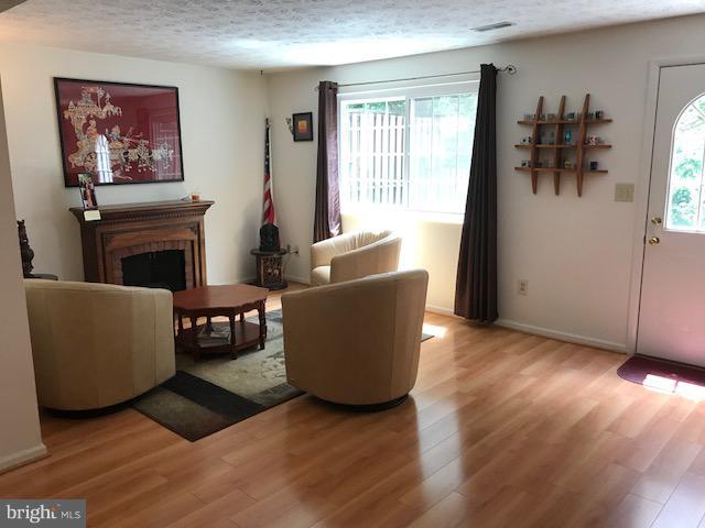 1644 Barnstead Drive Reston, VA 20194 - Photo 19 of 23 a living room with furniture and a fireplace