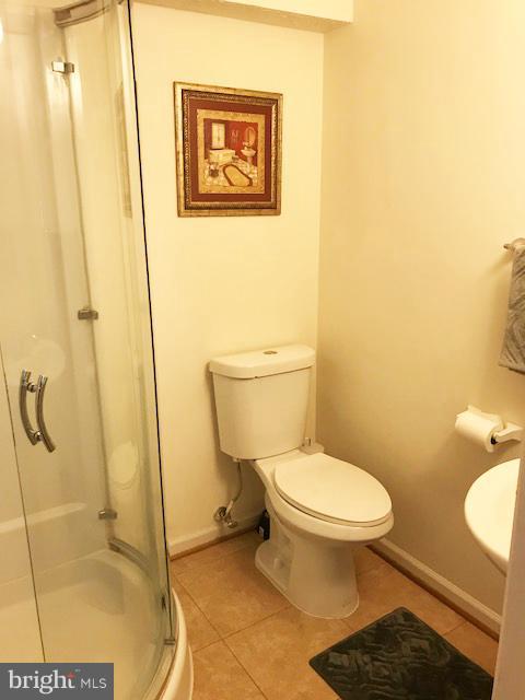 1644 Barnstead Drive Reston, VA 20194 - Photo 20 of 23 a white toilet sitting next to a bathroom sink
