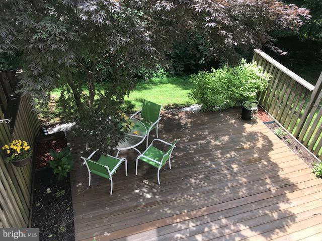 1644 Barnstead Drive Reston, VA 20194 - Photo 22 of 23 a view of a wooden deck with chairs and a tree