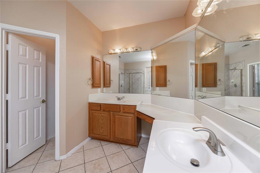 9201 Hunter Chase Drive McKinney, TX 75072 - Photo 15 of 35 a bathroom with a sink and a mirror