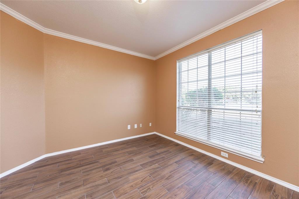 9201 Hunter Chase Drive McKinney, TX 75072 - Photo 18 of 35 wooden floor in an empty room with a window