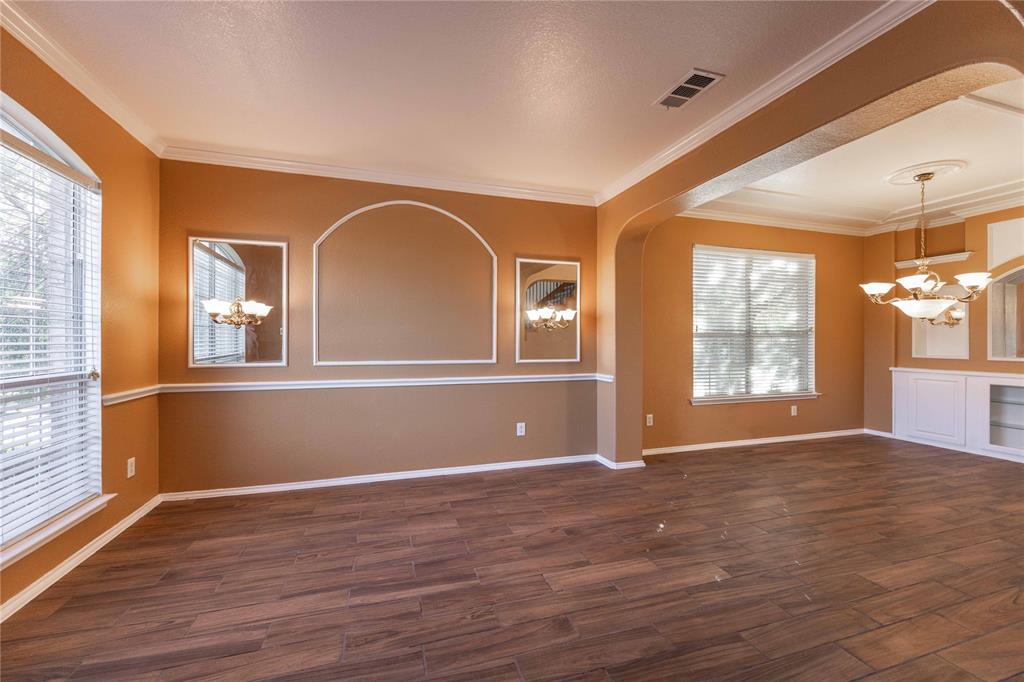 9201 Hunter Chase Drive McKinney, TX 75072 - Photo 2 of 35 a view of empty room with wooden floor and fan