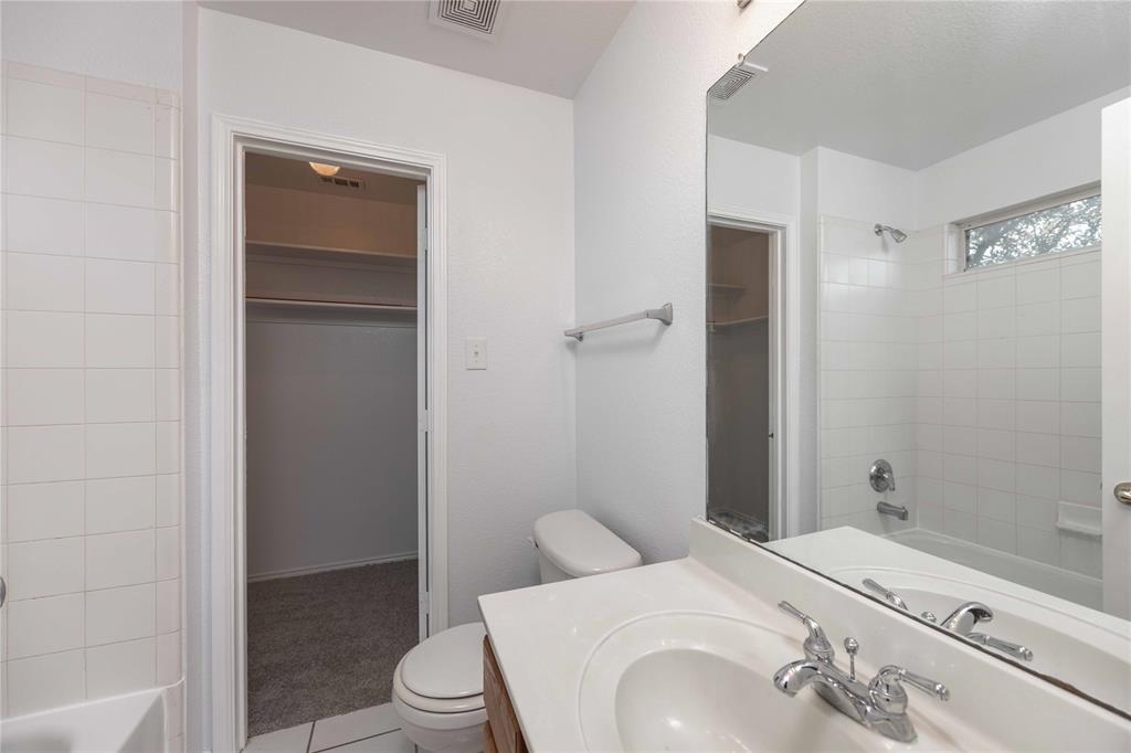 9201 Hunter Chase Drive McKinney, TX 75072 - Photo 25 of 35 a bathroom with a sink and toilet