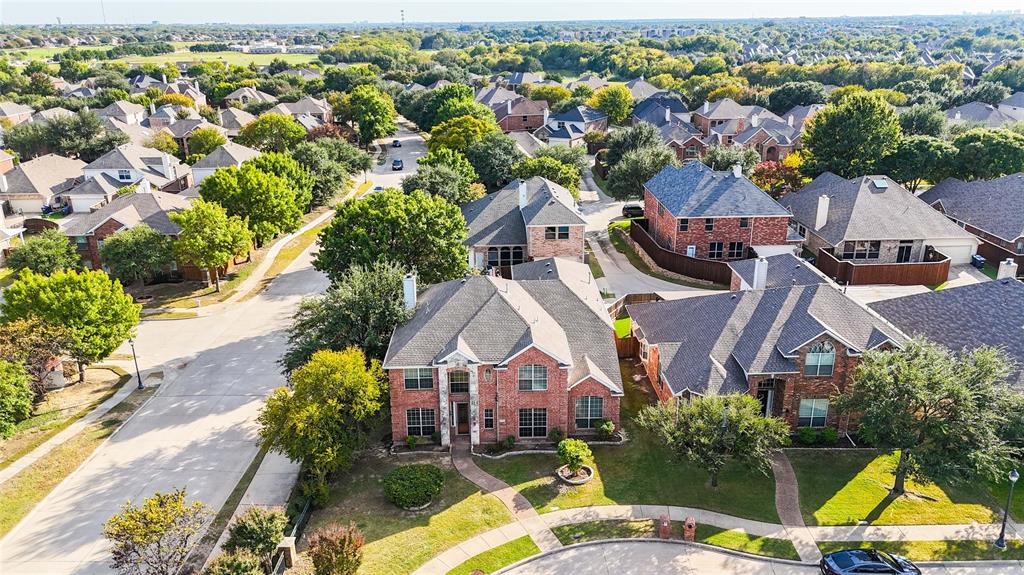9201 Hunter Chase Drive McKinney, TX 75072 - Photo 34 of 35 an aerial view of multiple houses with yard