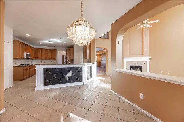a view of a kitchen with a sink and microwave