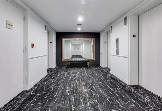 a bathroom with a shower sink vanity and mirror