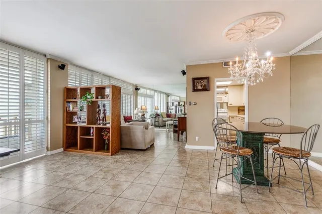 a view of a livingroom with furniture and chandelier