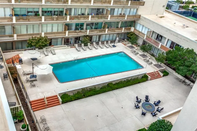 an aerial view of a house with a swimming pool