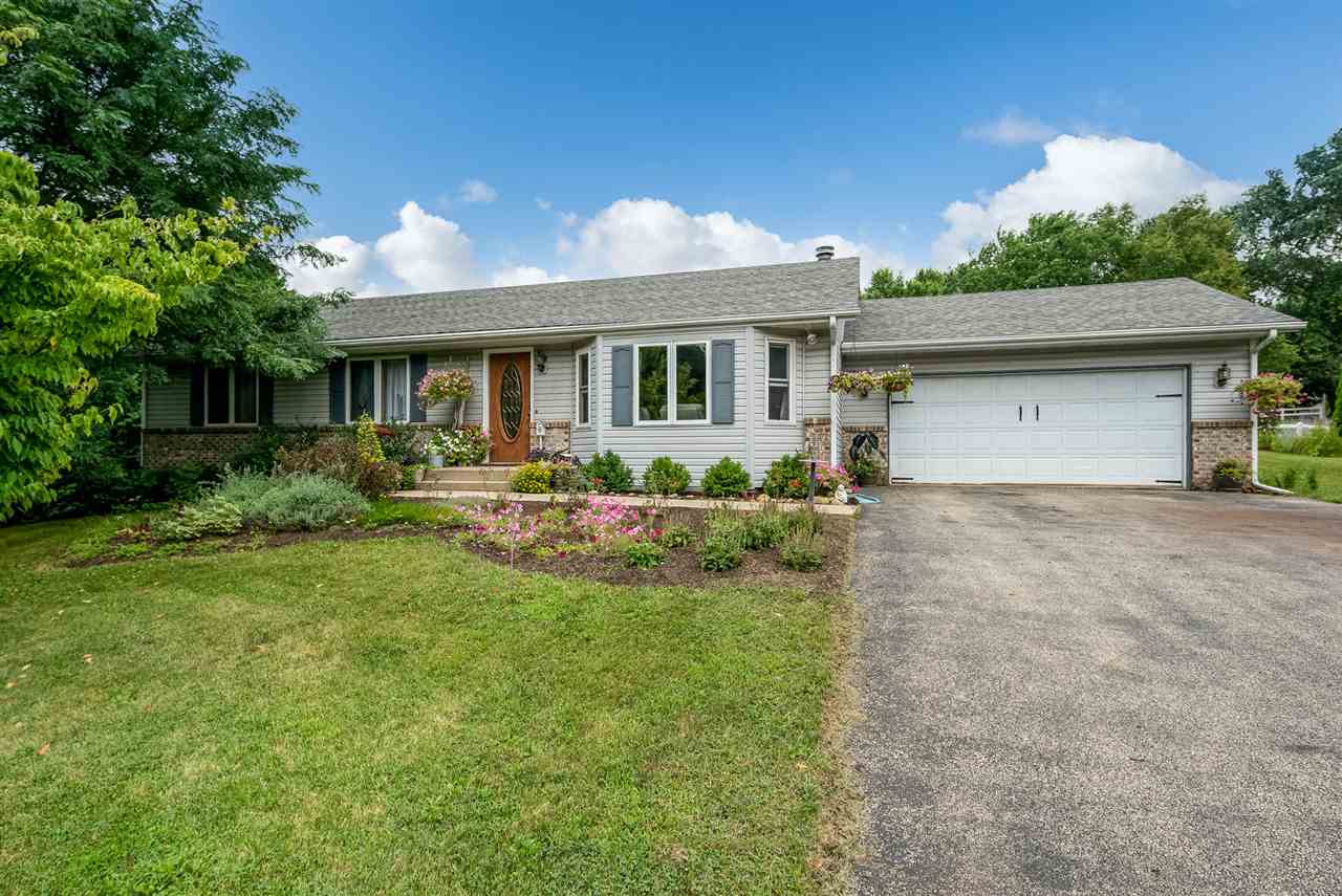 10111 Beaver Valley Road Belvidere, IL 61008 - Photo 1 of 25 a front view of house with yard and green space
