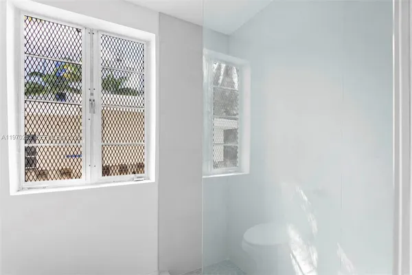 a view of a room that has a window in it