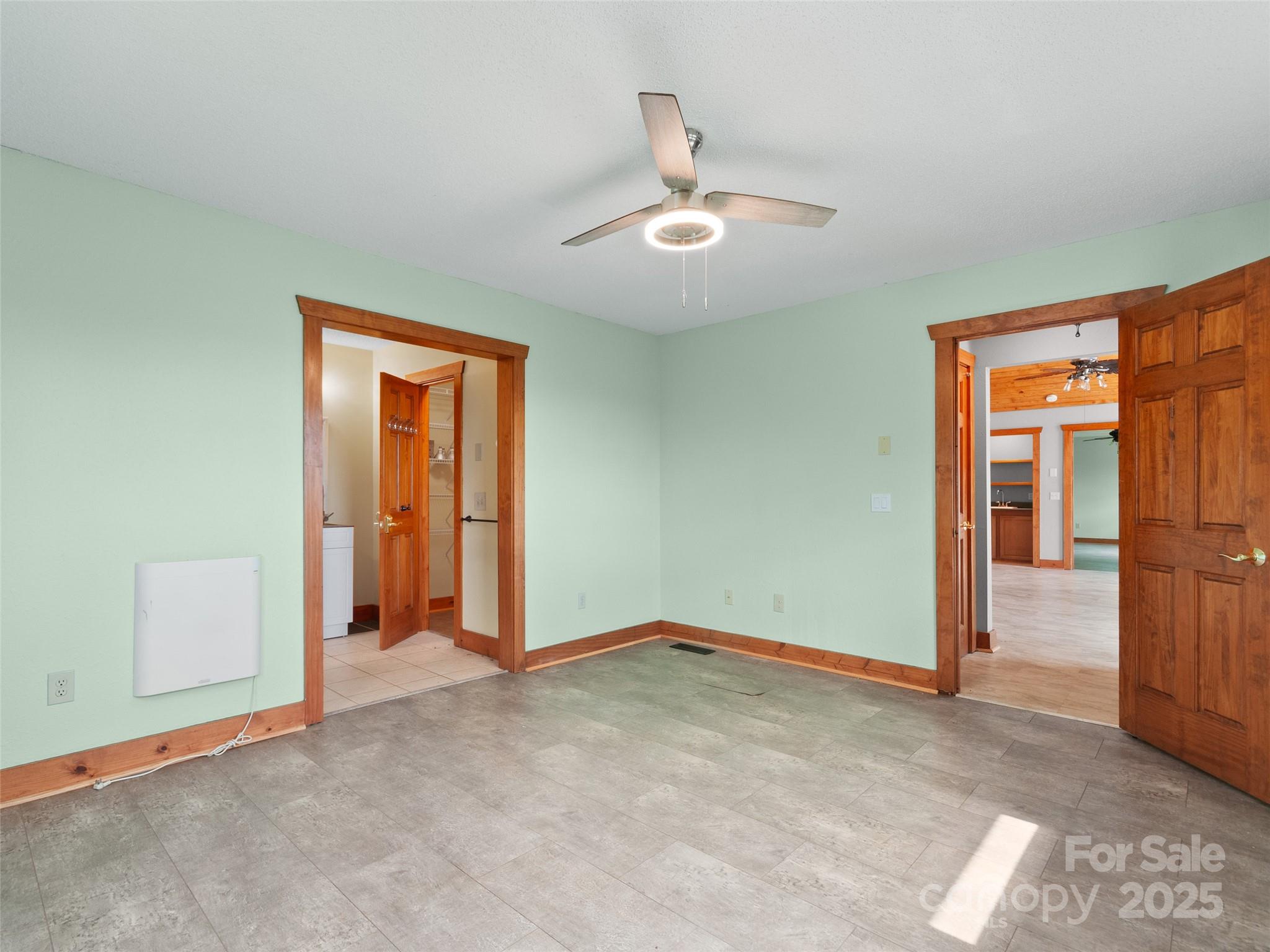 672 Windswept Ridge Road Leicester, NC 28748 - Photo 15 of 30 an empty room with closet and fan