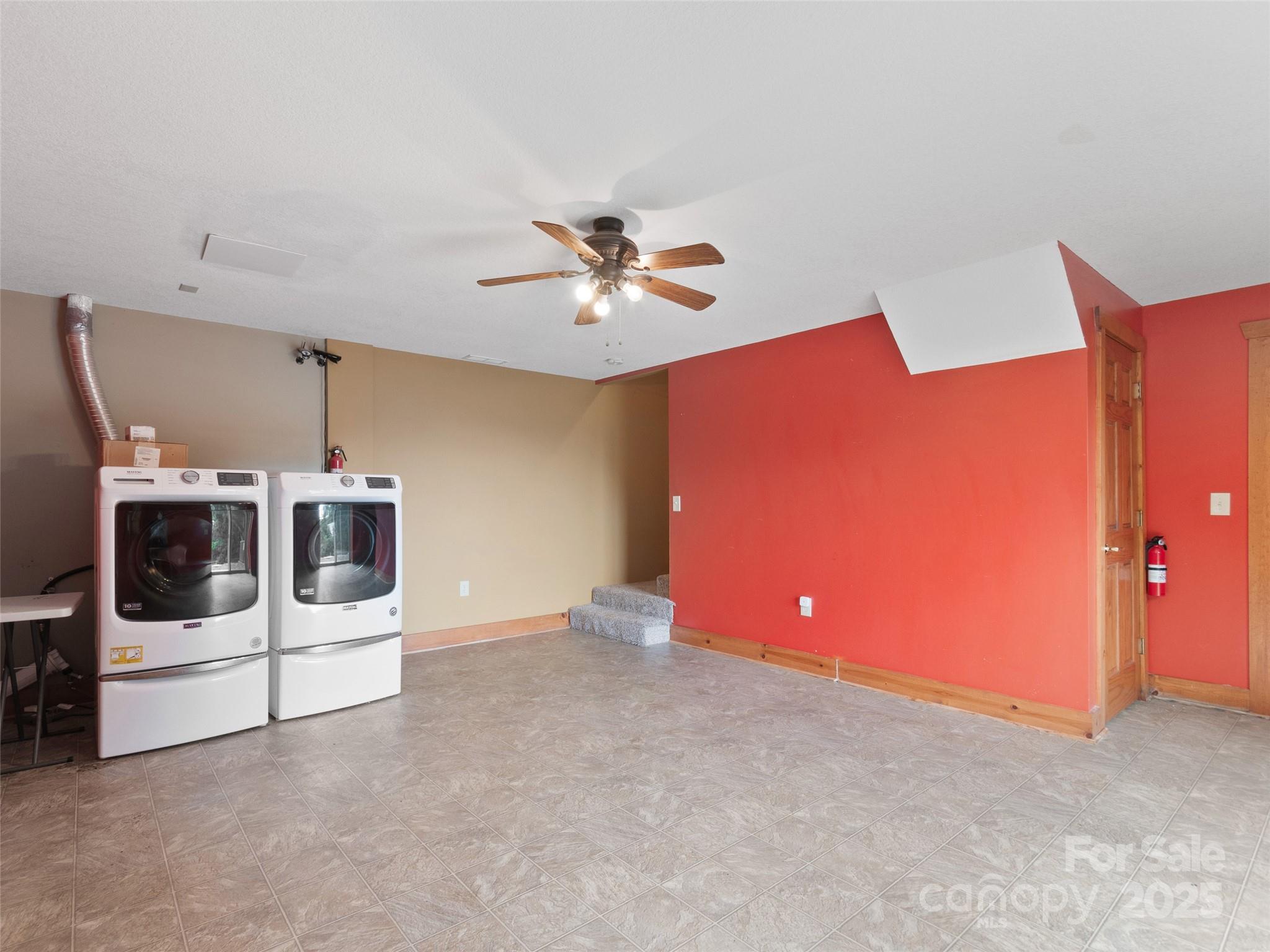 672 Windswept Ridge Road Leicester, NC 28748 - Photo 18 of 30 a view of a livingroom with furniture and chandelier fan