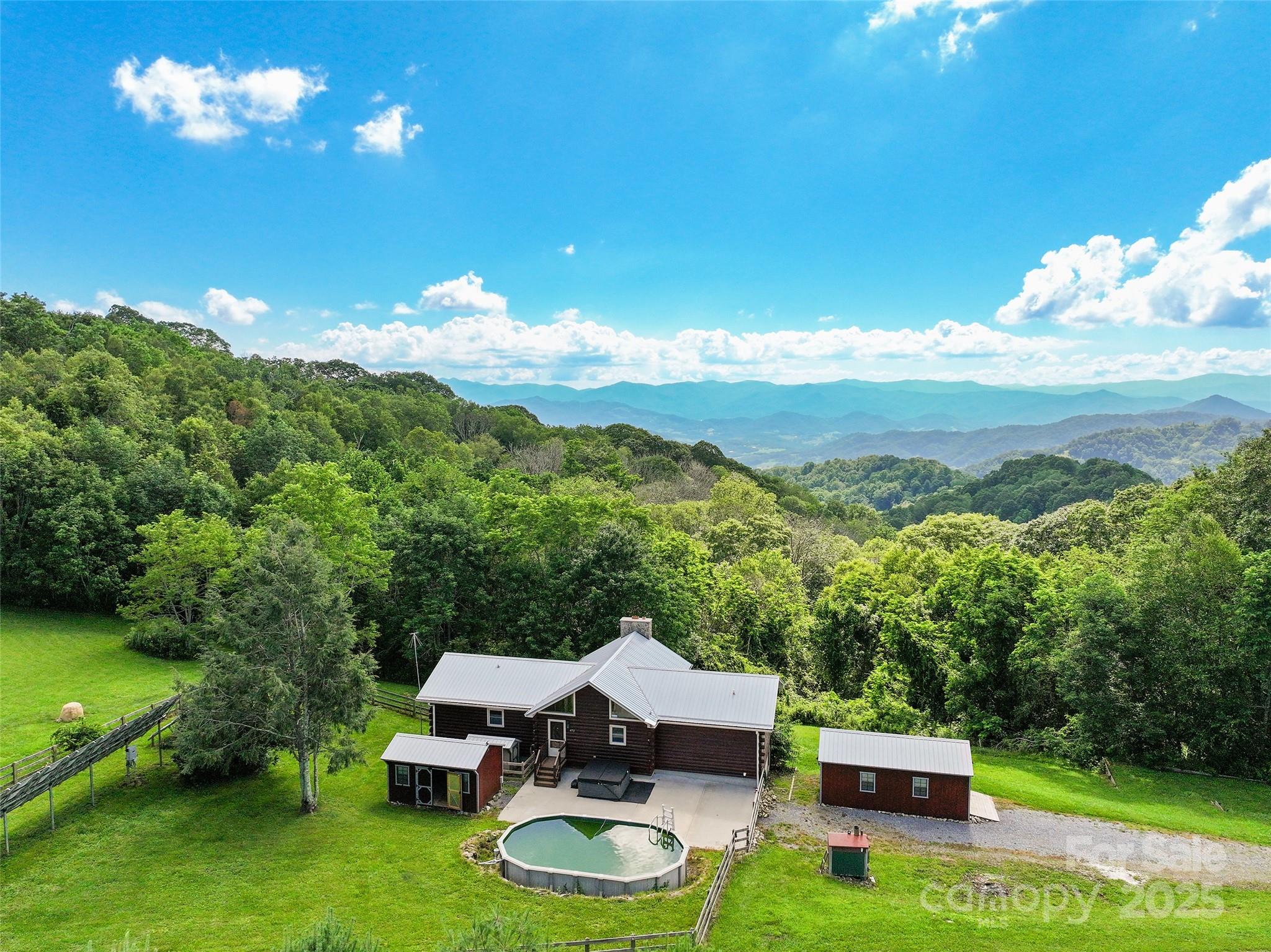 672 Windswept Ridge Road Leicester, NC 28748 - Photo 29 of 30 a view of a chairs with a table in the patio