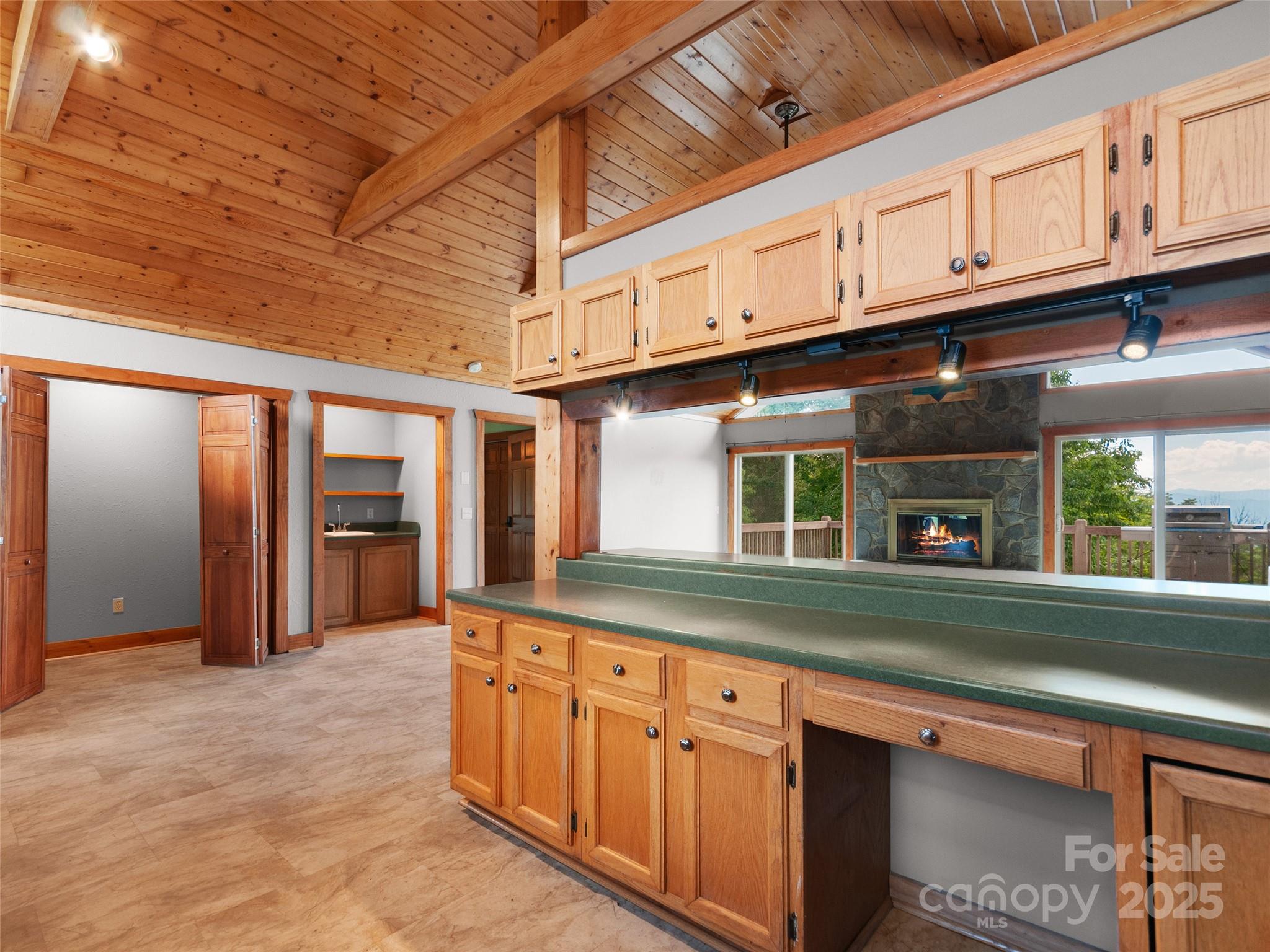 672 Windswept Ridge Road Leicester, NC 28748 - Photo 4 of 30 a kitchen with granite countertop a sink and cabinets