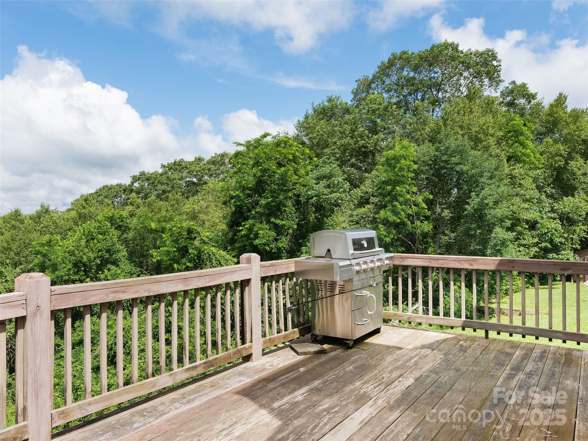 672 Windswept Ridge Road Leicester, NC 28748 - Photo 8 of 30 a balcony with wooden floor and fence