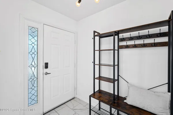 a bathroom with a shower and a window