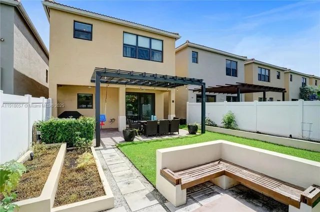a backyard of a house with seating space