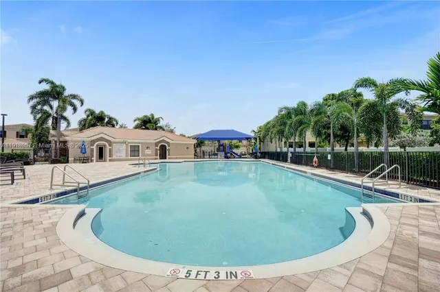 a view of a house with swimming pool