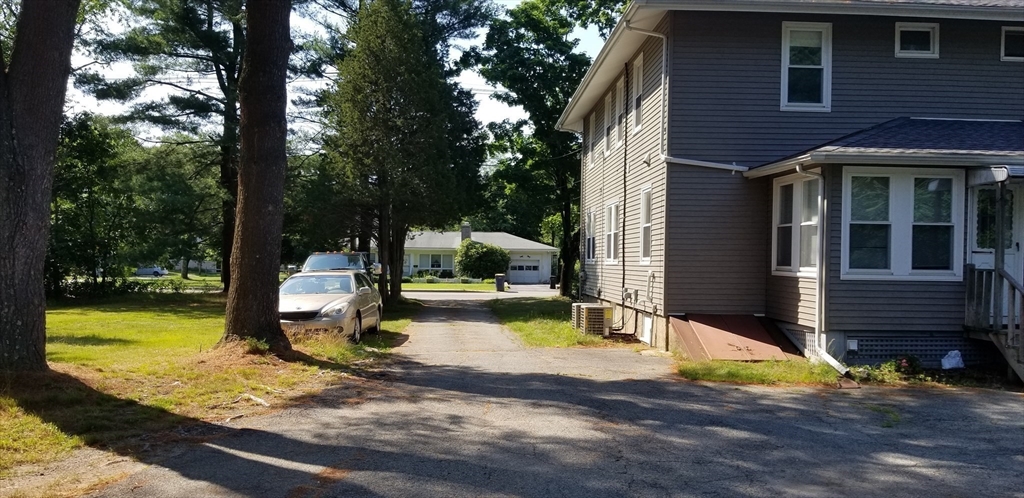 403 South Main Street, Unit 1 Sharon, MA 02067 - Photo 3 of 16 a view of a house with backyard