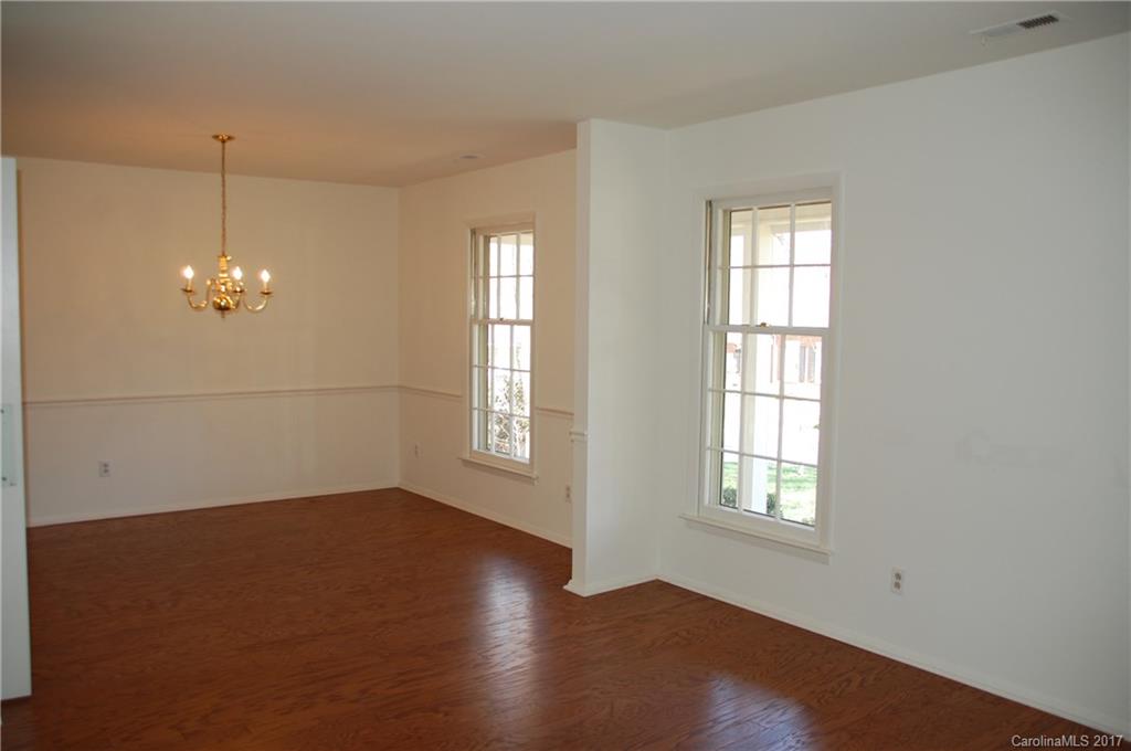 715 Trail Ridge Road Matthews, NC 28105 - Photo 2 of 13 a view of empty room with wooden floor and fan