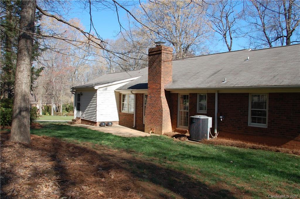 715 Trail Ridge Road Matthews, NC 28105 - Photo 12 of 13 a front view of a house with a yard and garden