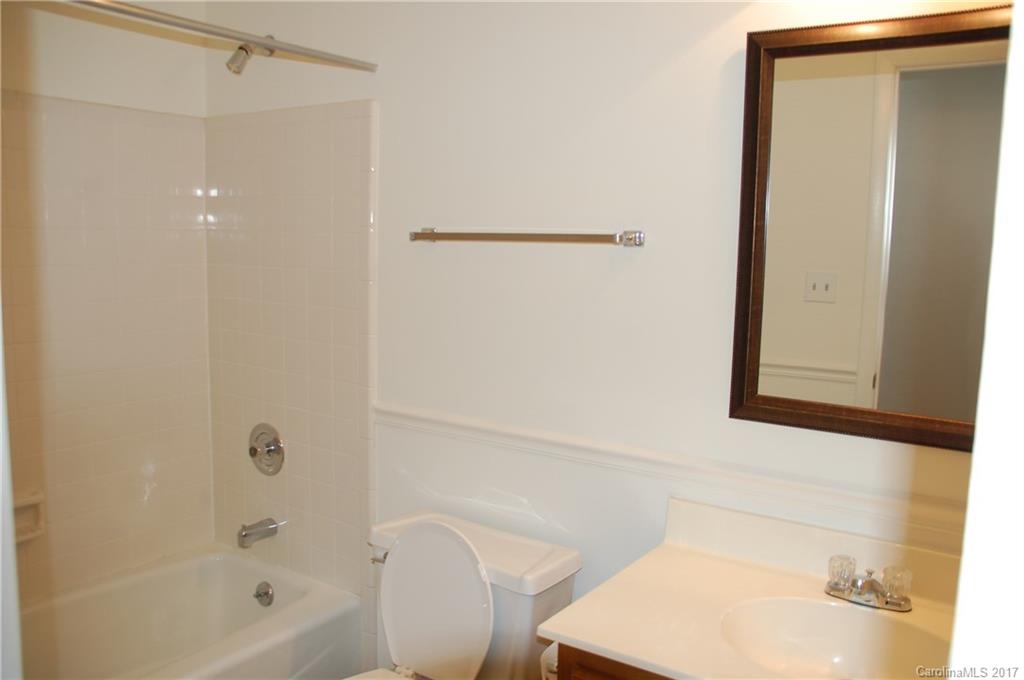 715 Trail Ridge Road Matthews, NC 28105 - Photo 3 of 13 a bathroom with a bathtub and a sink