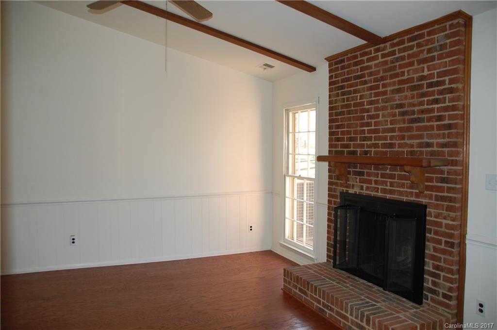 715 Trail Ridge Road Matthews, NC 28105 - Photo 7 of 13 a view of a livingroom with an empty space and a fireplace
