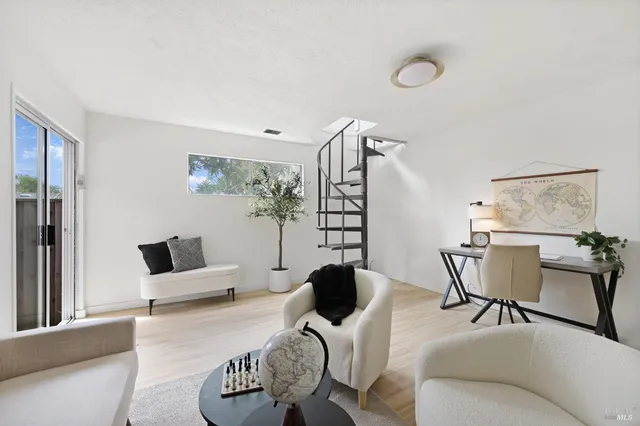 a bedroom with a bed and a potted plant