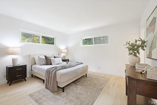 a bedroom with a bed and a view of bathroom