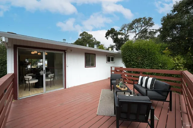 a view of a terrace with couches and potted plants