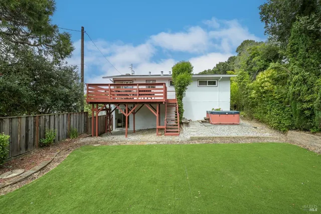 a view of a porch with a yard fire pit and furniture