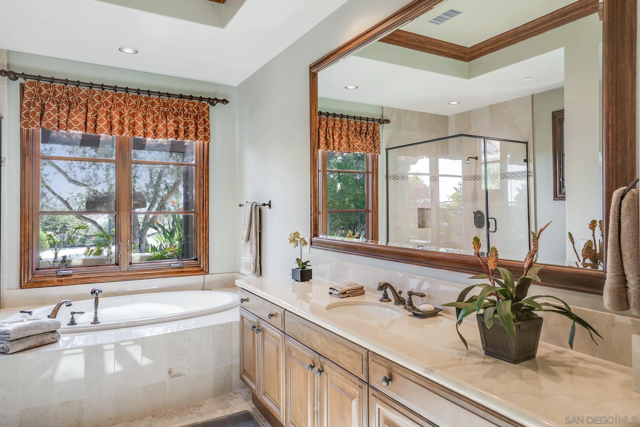 16581 Rd To Rio San Diego, CA 92127 - Photo 11 of 48 a bathroom with a tub a sink and a large mirror