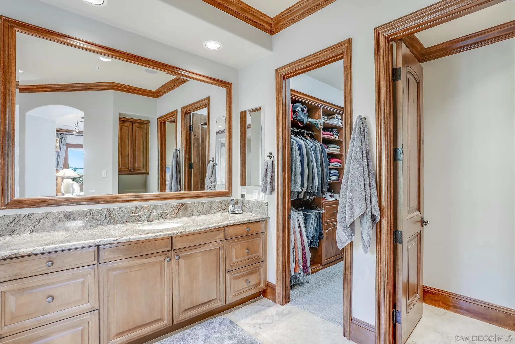 16581 Rd To Rio San Diego, CA 92127 - Photo 24 of 48 a bathroom with a granite countertop sink and a mirror