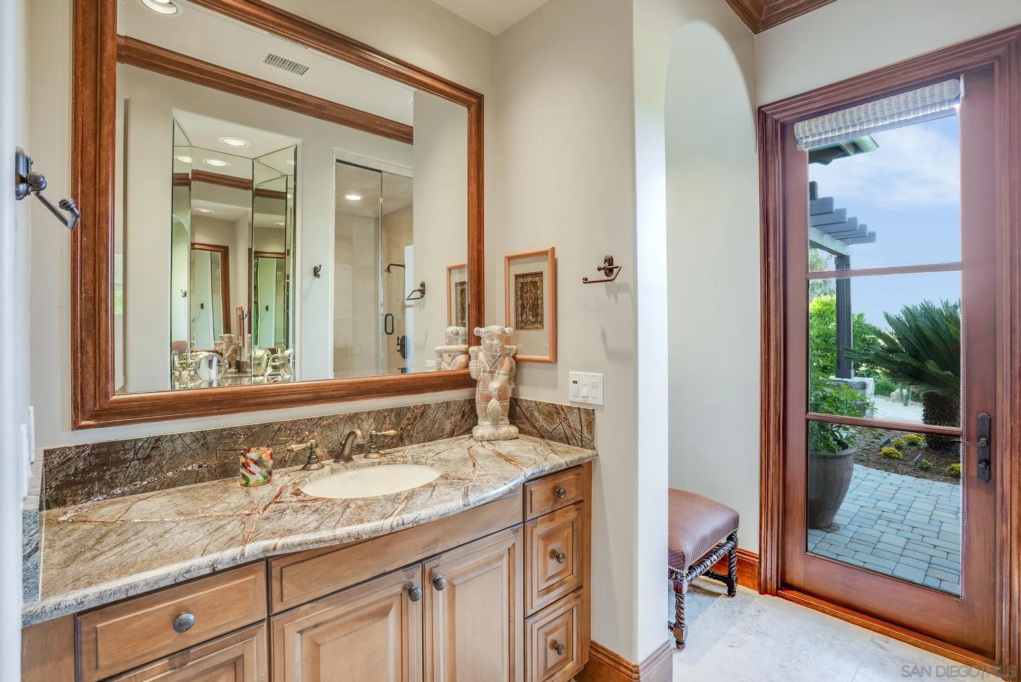 16581 Rd To Rio San Diego, CA 92127 - Photo 27 of 48 a bathroom with a granite countertop sink and a mirror