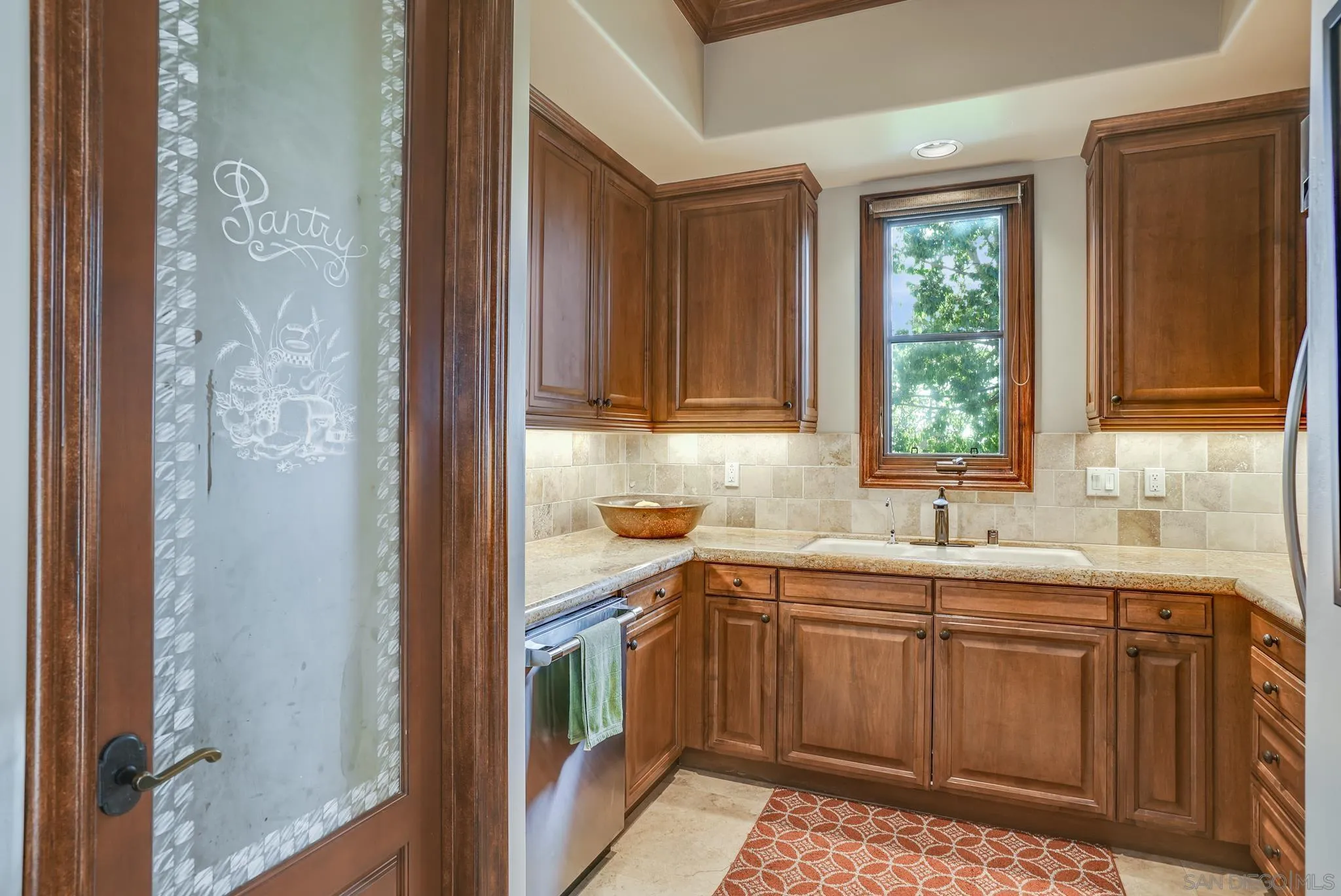 16581 Rd To Rio San Diego, CA 92127 - Photo 38 of 48 a kitchen with a sink and cabinets