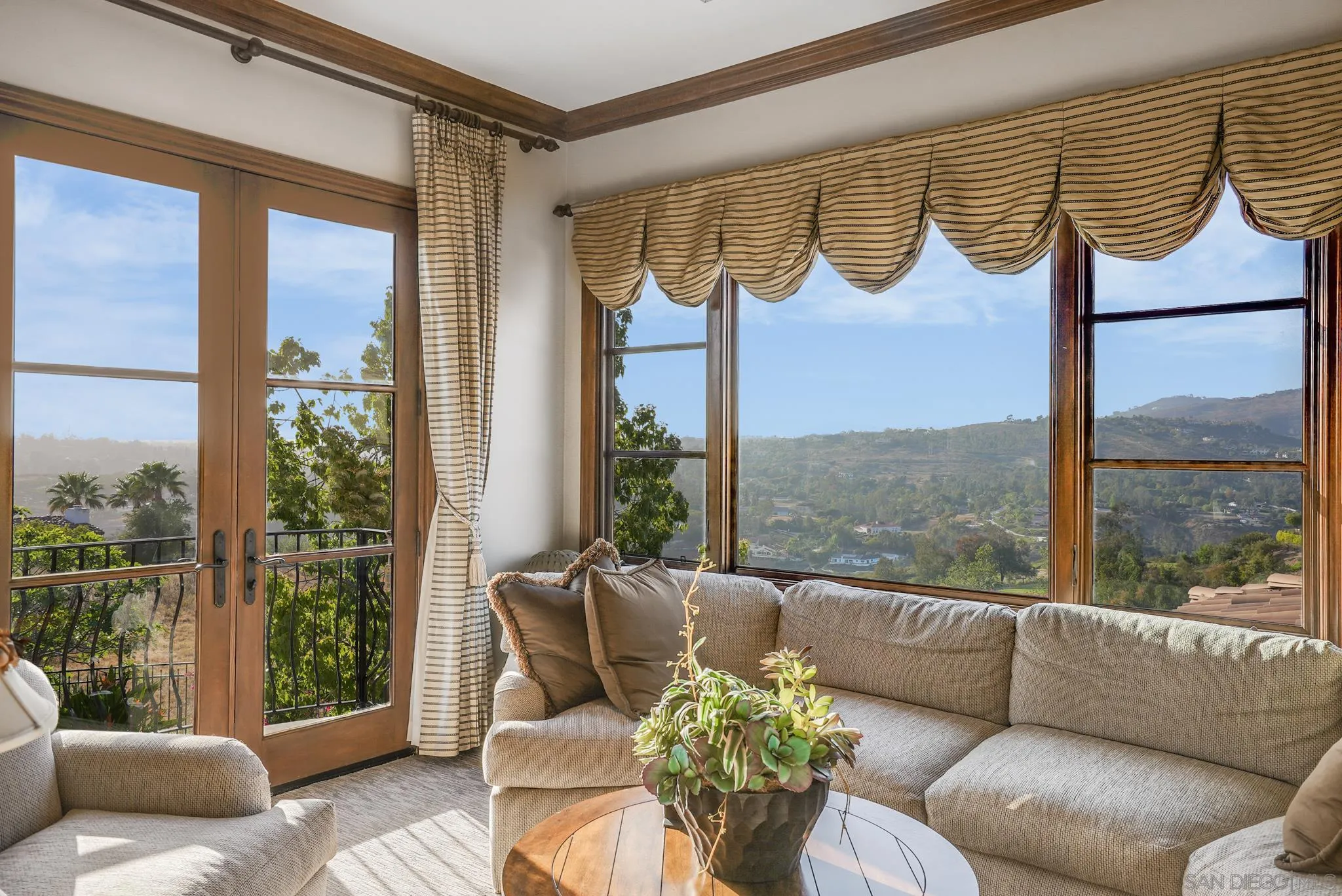 16581 Rd To Rio San Diego, CA 92127 - Photo 45 of 48 a living room with furniture and a floor to ceiling window