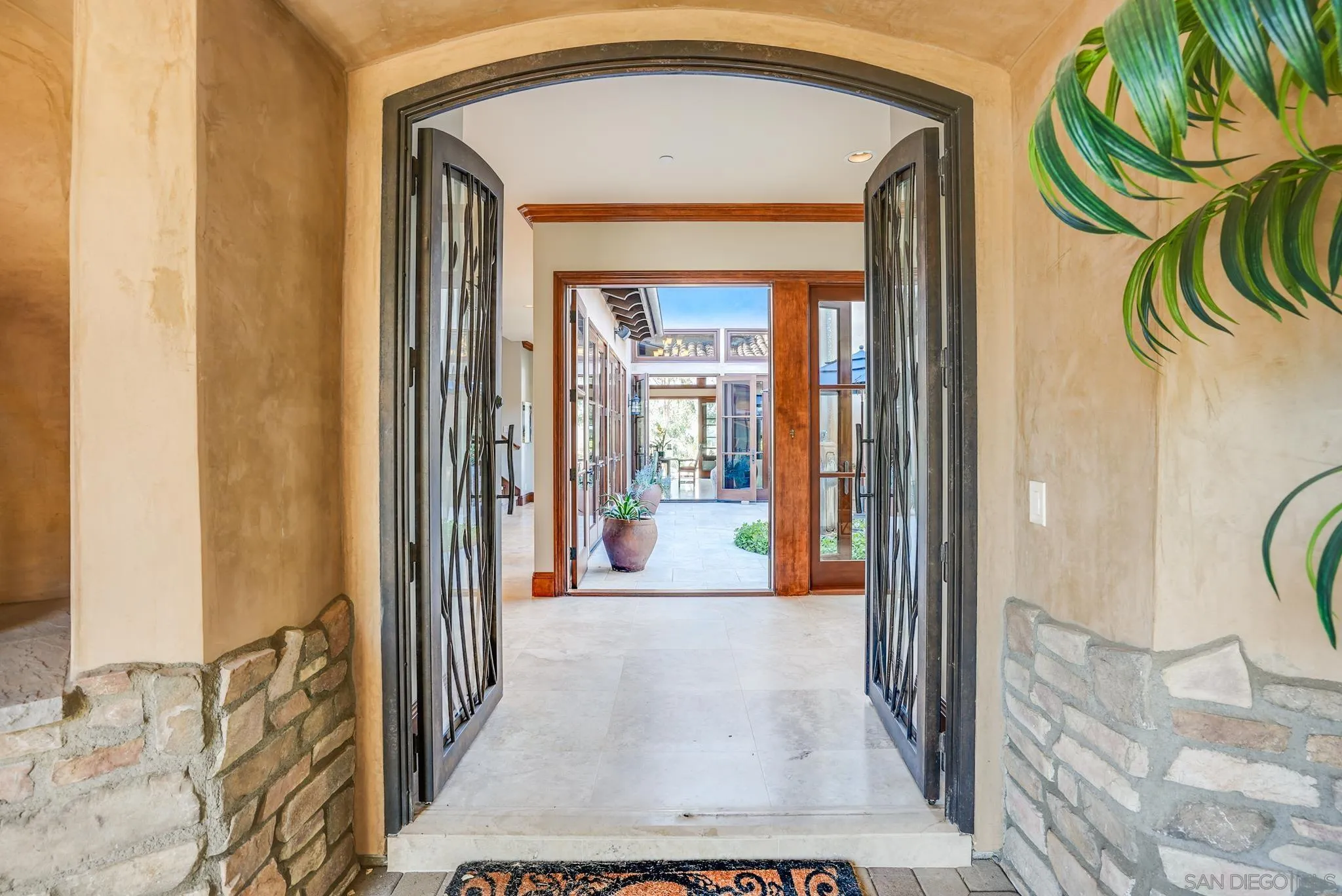 16581 Rd To Rio San Diego, CA 92127 - Photo 7 of 48 a view of a hallway to a livingroom and a dinning area with furniture