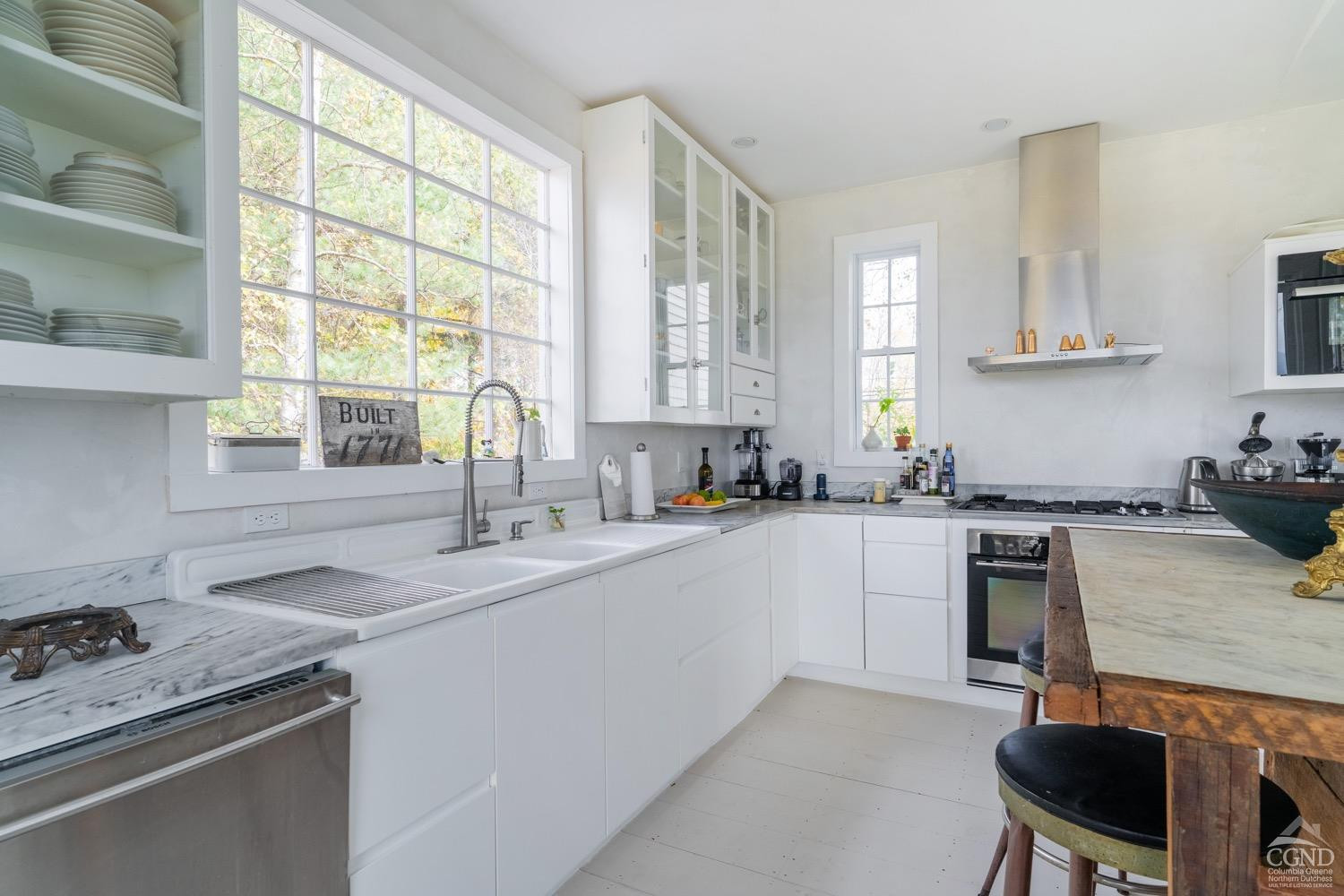 145 East Camp Road Germantown, NY 12526 - Photo 15 of 37 a kitchen with a sink stove top oven and cabinets