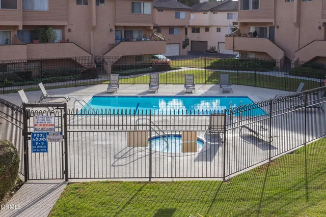 a view of building with yard and staircase