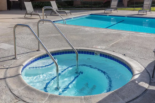 a view of a swimming pool with a chairs