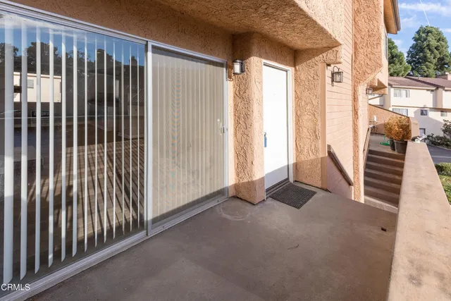 a view of a balcony with an outdoor space