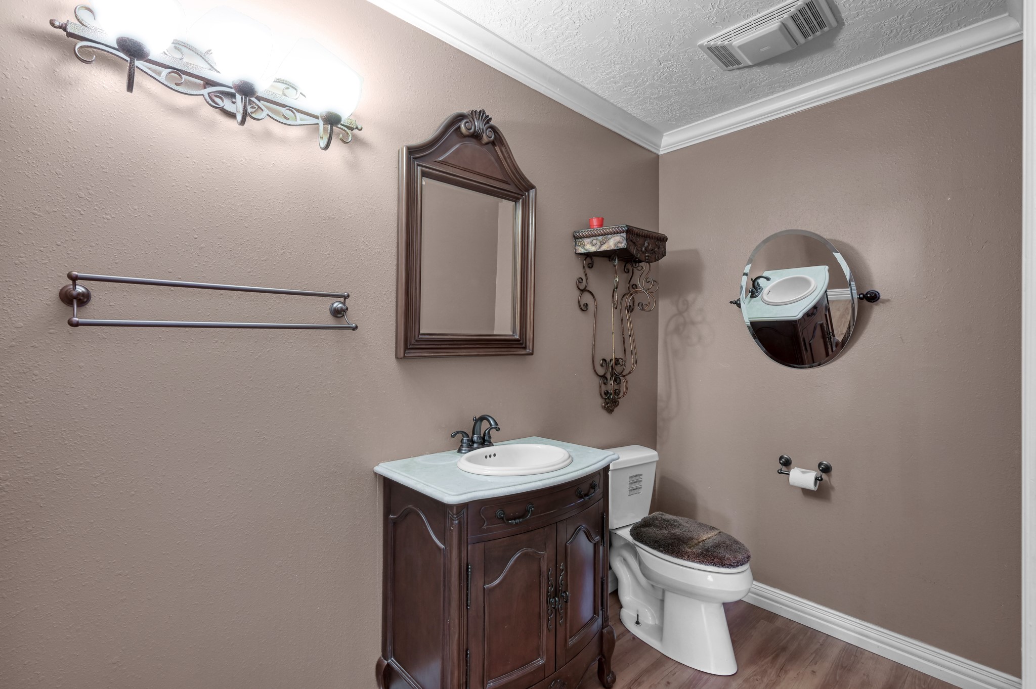 144 Wood Farm Road Huntsville, TX 77320 - Photo 6 of 35 a bathroom with a toilet sink and mirror