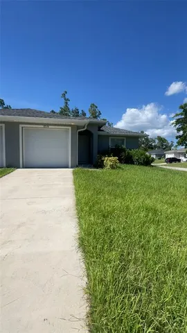 a view of a terrace with a yard