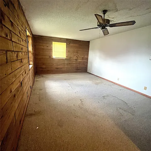 a view of empty room with windows