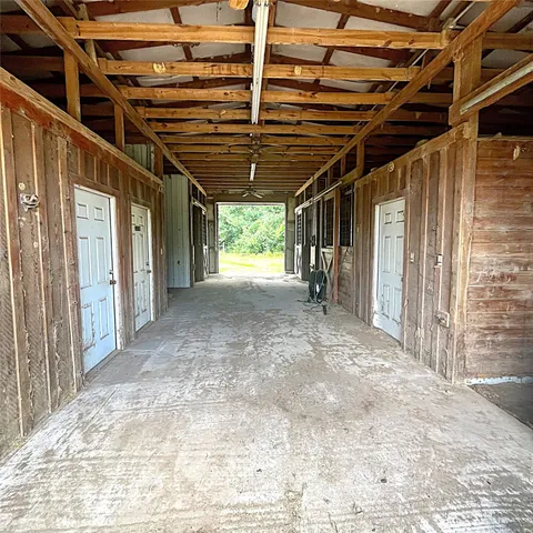 a view of empty room with wooden walls