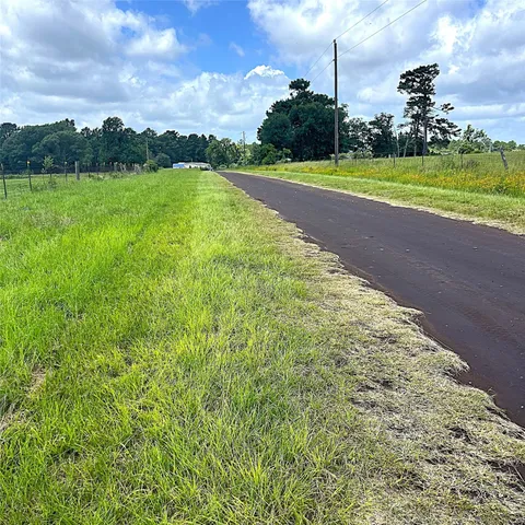 a view of a golf course with a lake