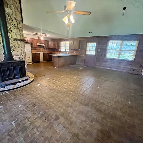 a view of a livingroom with furniture and windows