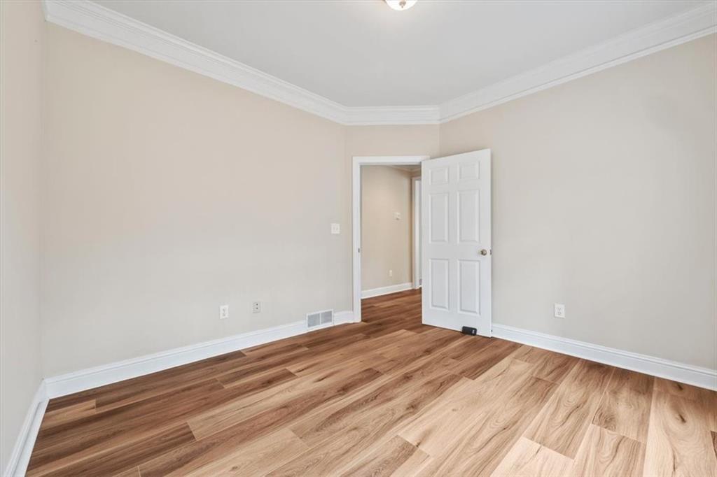4115 Montvale Crossing Cumming, GA 30041 - Photo 16 of 40 a view of room with wooden floor