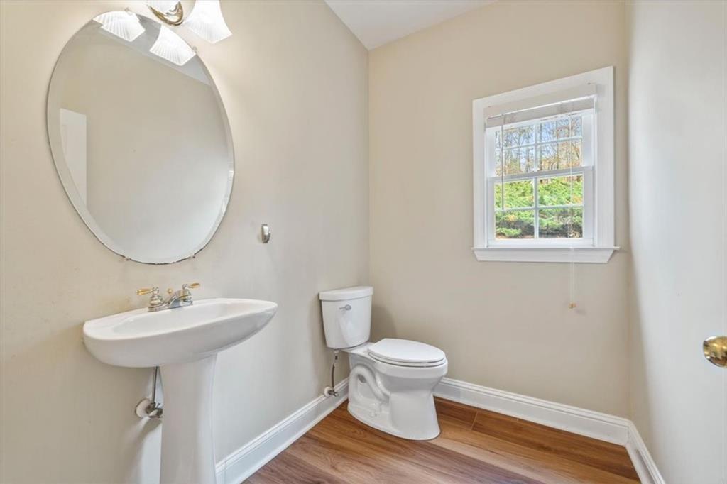 4115 Montvale Crossing Cumming, GA 30041 - Photo 17 of 40 a bathroom with a sink toilet and a mirror