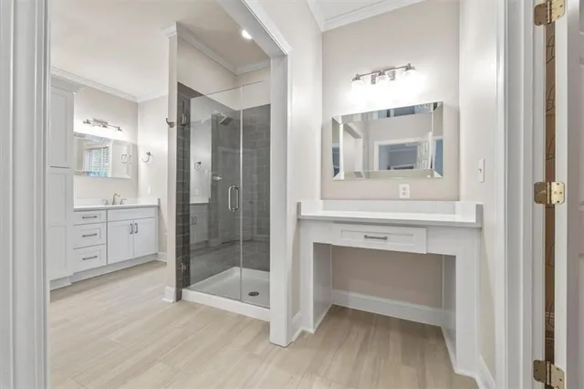 a bathroom with a shower sink and mirror